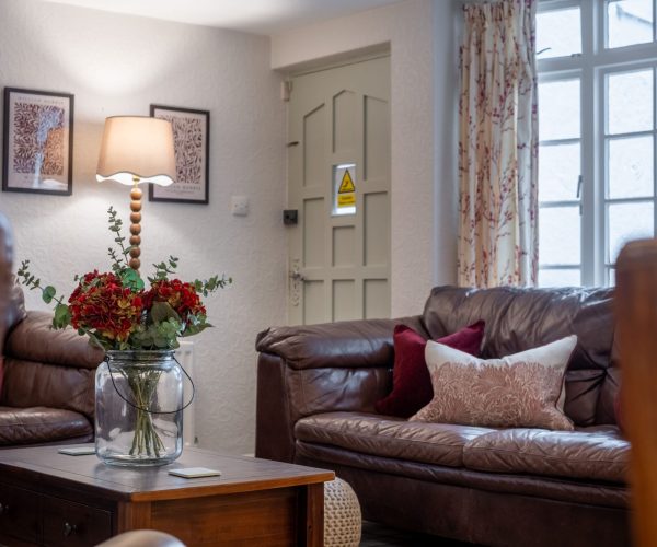 The inviting living area at Jessamy Cottage, a dog-friendly holiday home in Bowness-on-Windermere.