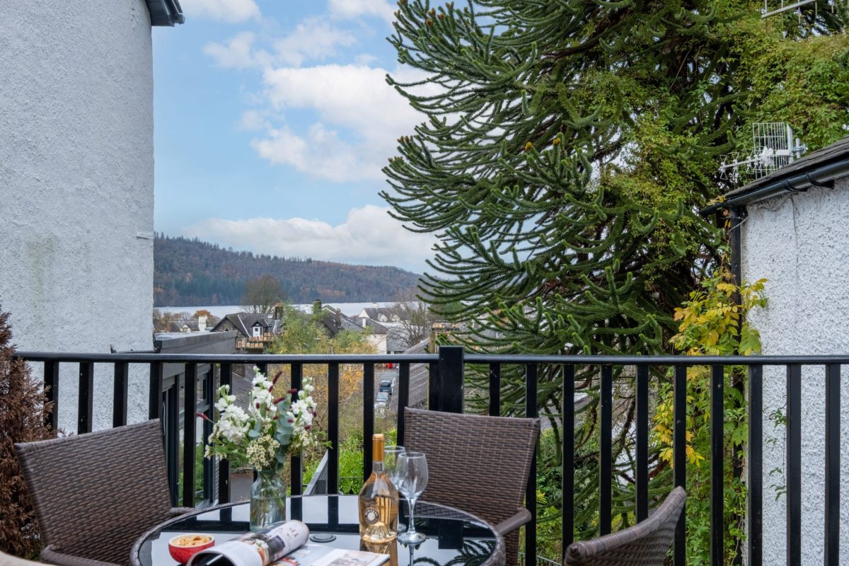Private decked terrace with stunning lake views â€“ a highlight of Jessamy Cottage.