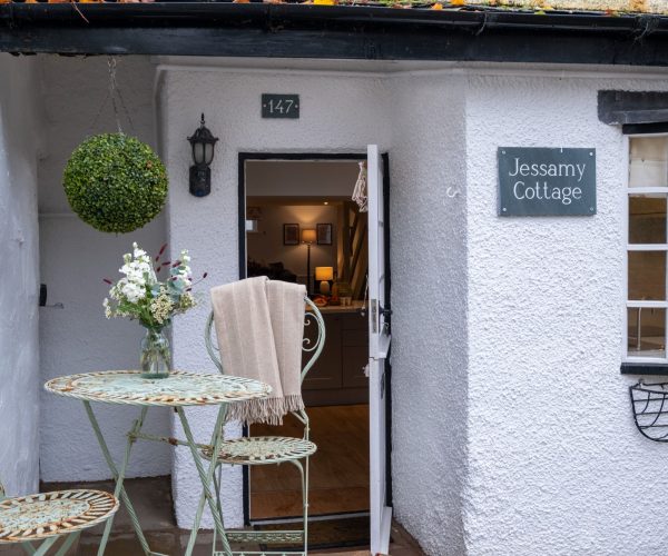 The welcoming exterior of Jessamy Cottage, a dog-friendly Lake District holiday home with parking.