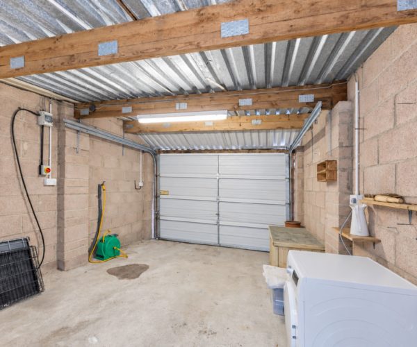 Generous garage with tumble dryer and storage for walking gear in Windermere